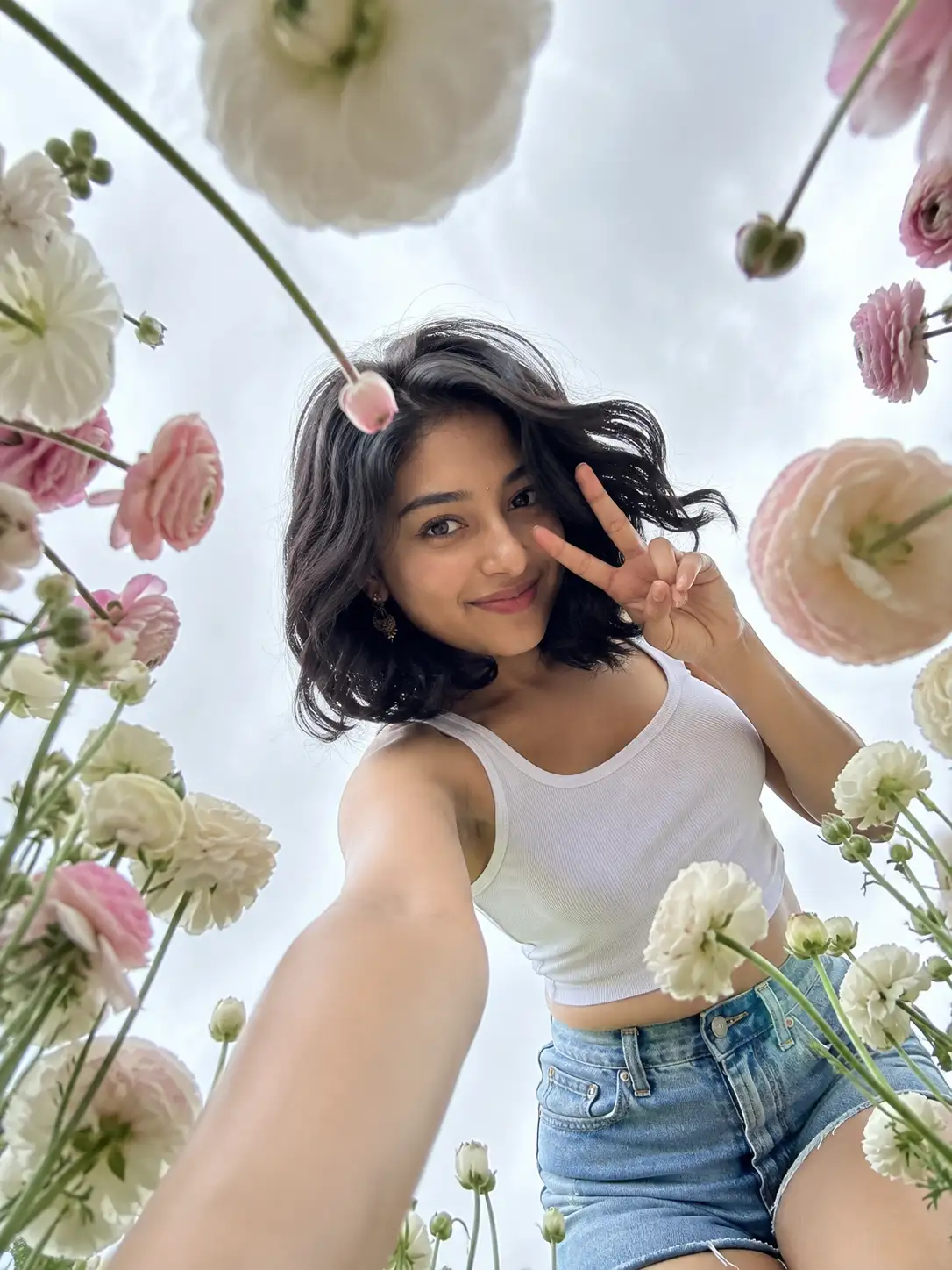 Low-Angle Floral Selfie Portrait with 100% Face Accuracy — ChatGPT prompt | pineprompts.com