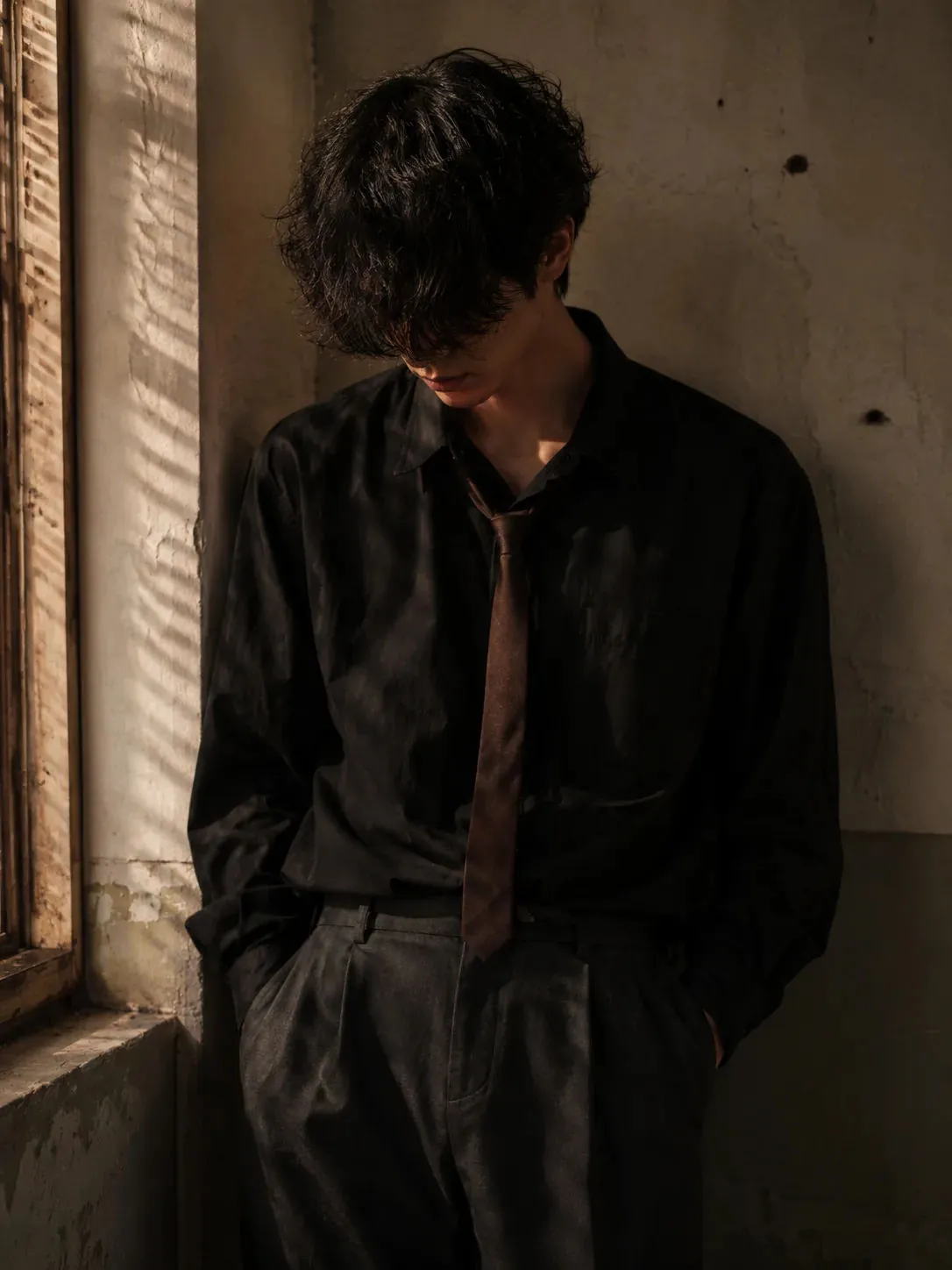 Moody Cinematic Portrait of a Lonely Young Man in Warm Window Light — ChatGPT prompt | pineprompts.com